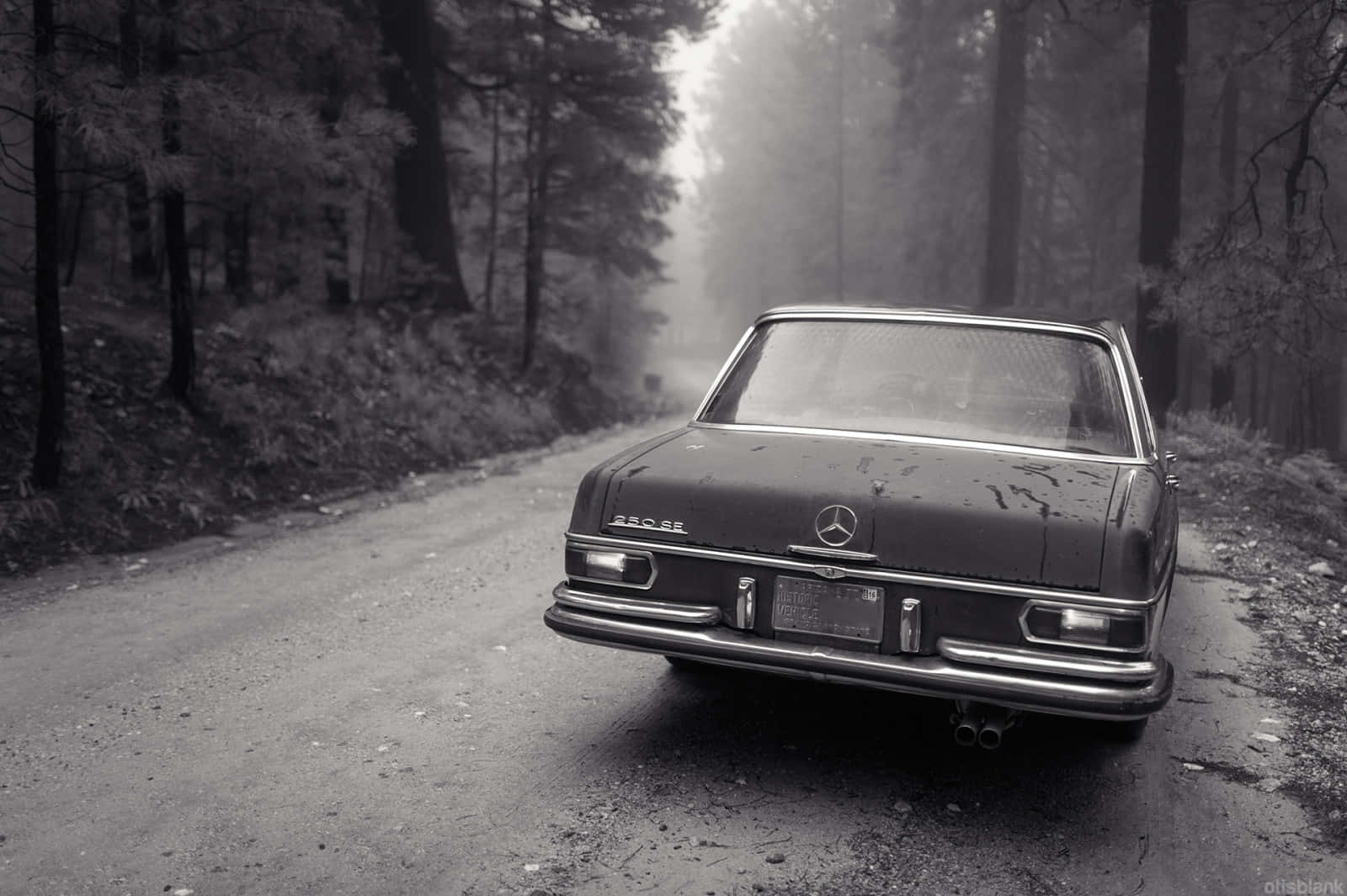 Classic Elegance of a Black and White Vintage Car Wallpaper