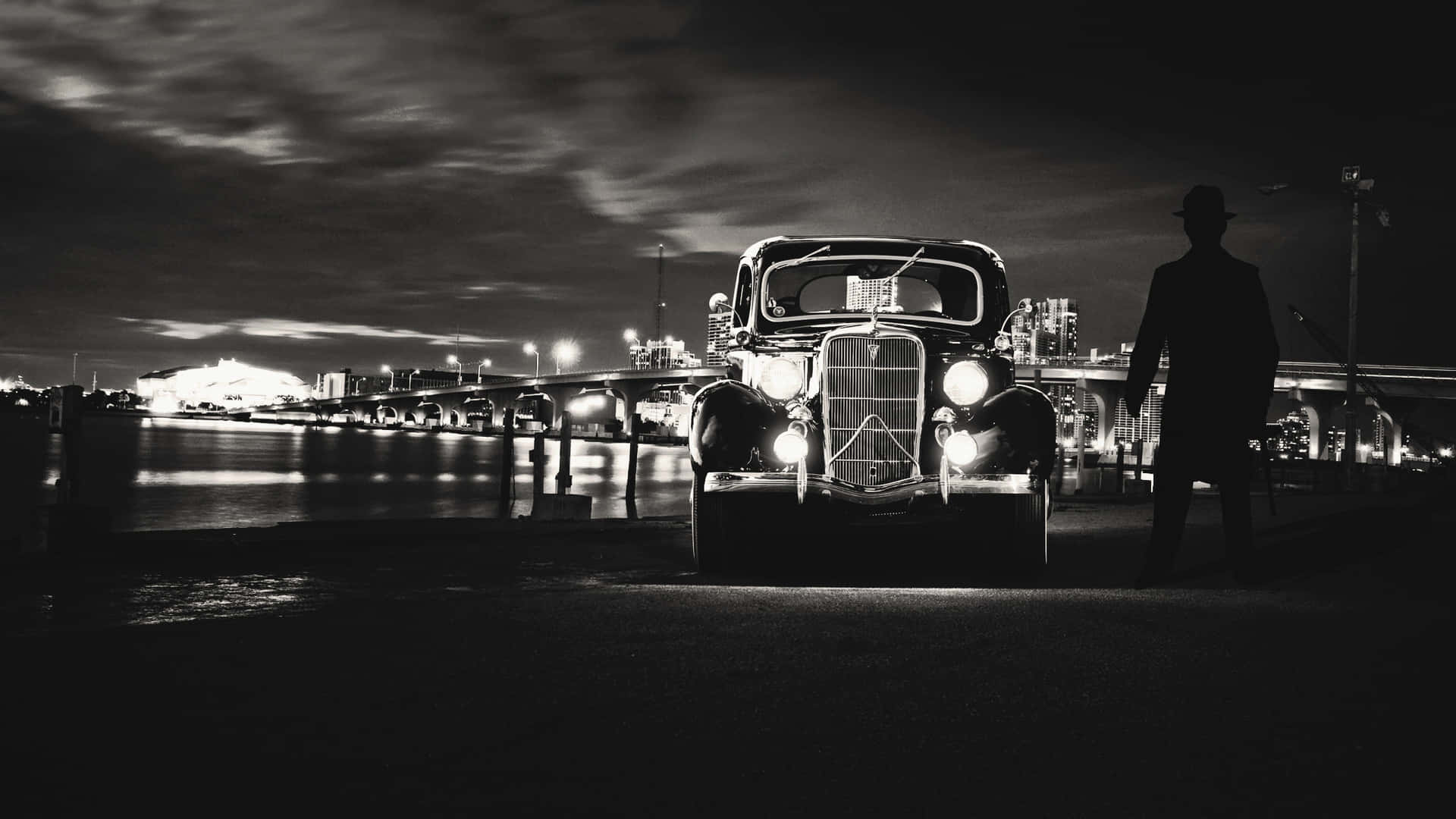Caption: Timeless Elegance - Black and White Vintage Car Wallpaper