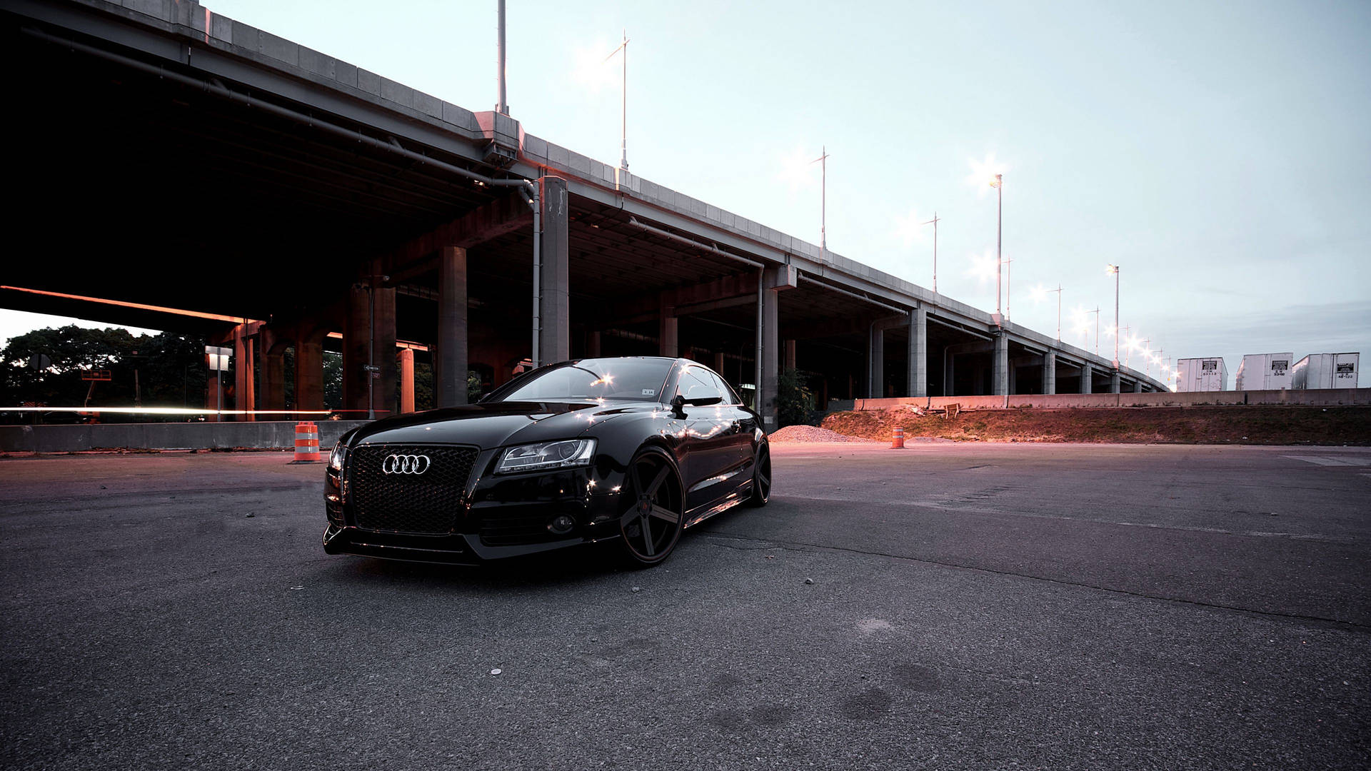 Caption: Sleek Black Audi RS5 - Emblem of Sophistication and Power Wallpaper