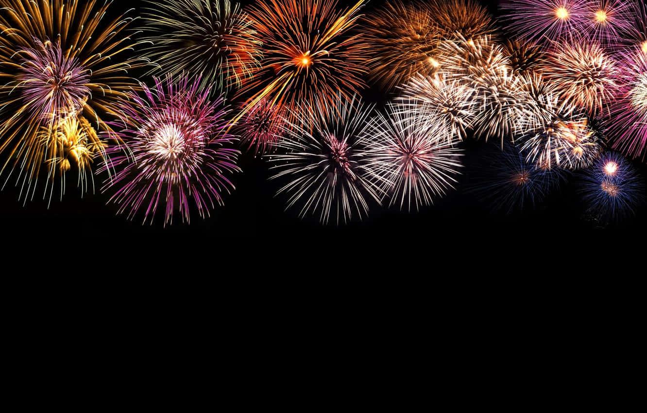 Black Background With Numerous Fireworks Wallpaper