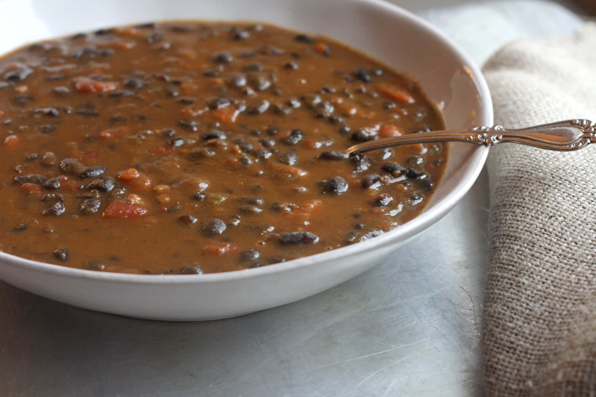 Enjoy a Hearty Bowl of Classic Black Bean Soup Wallpaper