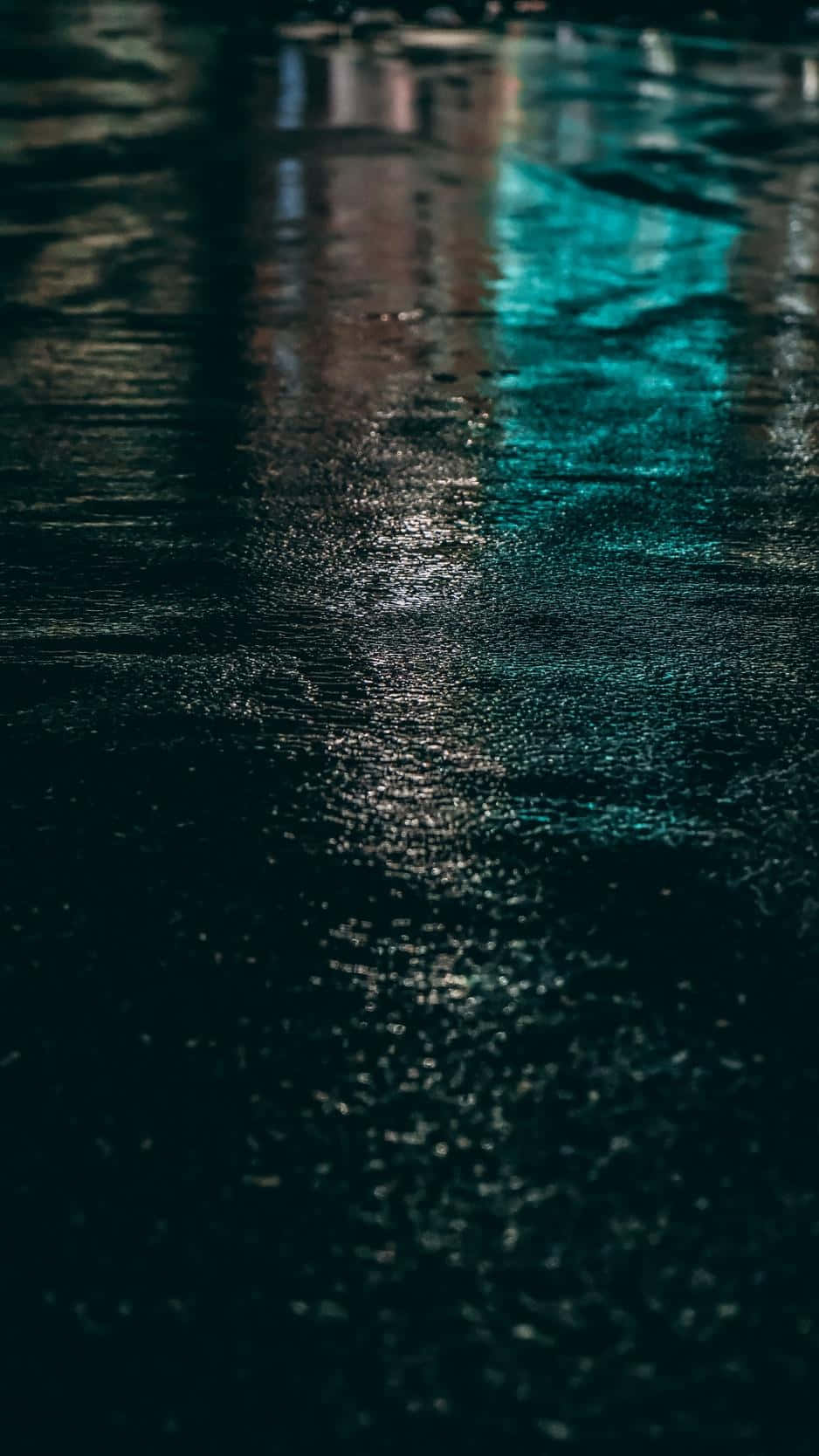 A City At Night With A Rainy Street