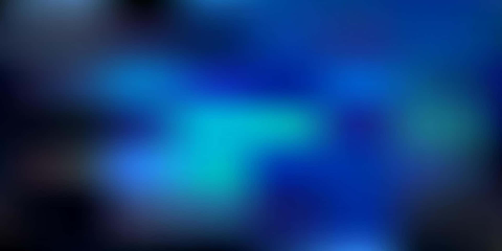 A Blurry Blue Background With A Blue Light