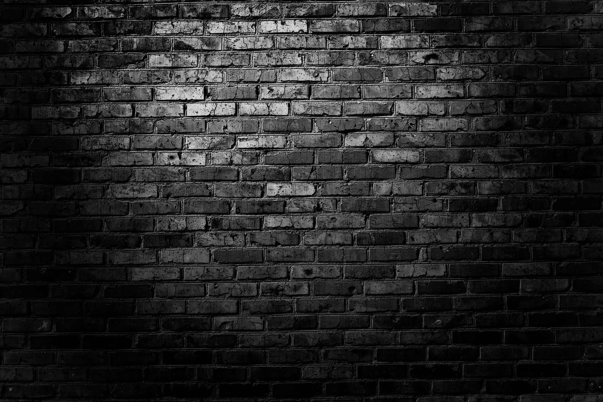A Black And White Photo Of A Brick Wall