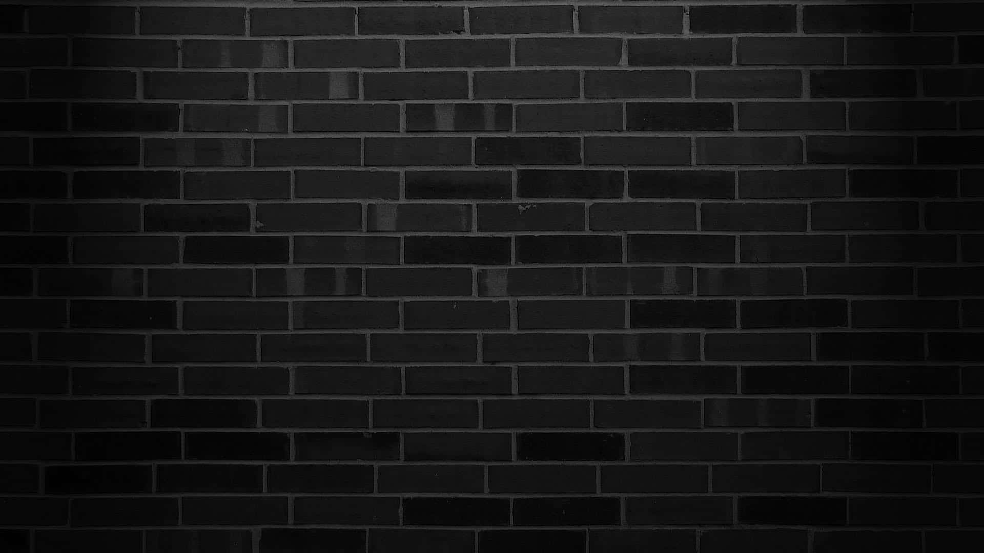 A black brick wall with a unique texture