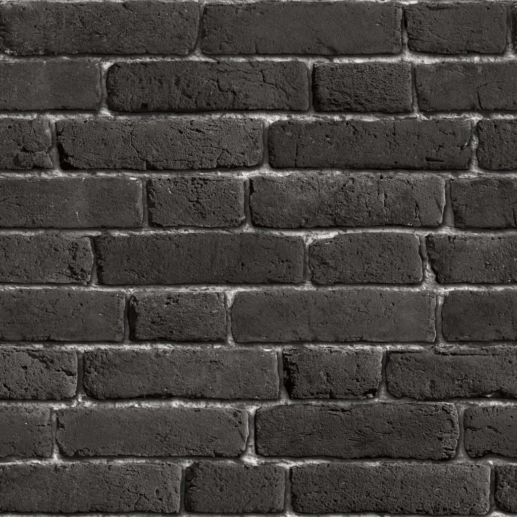 A Black Brick Wall With White Bricks