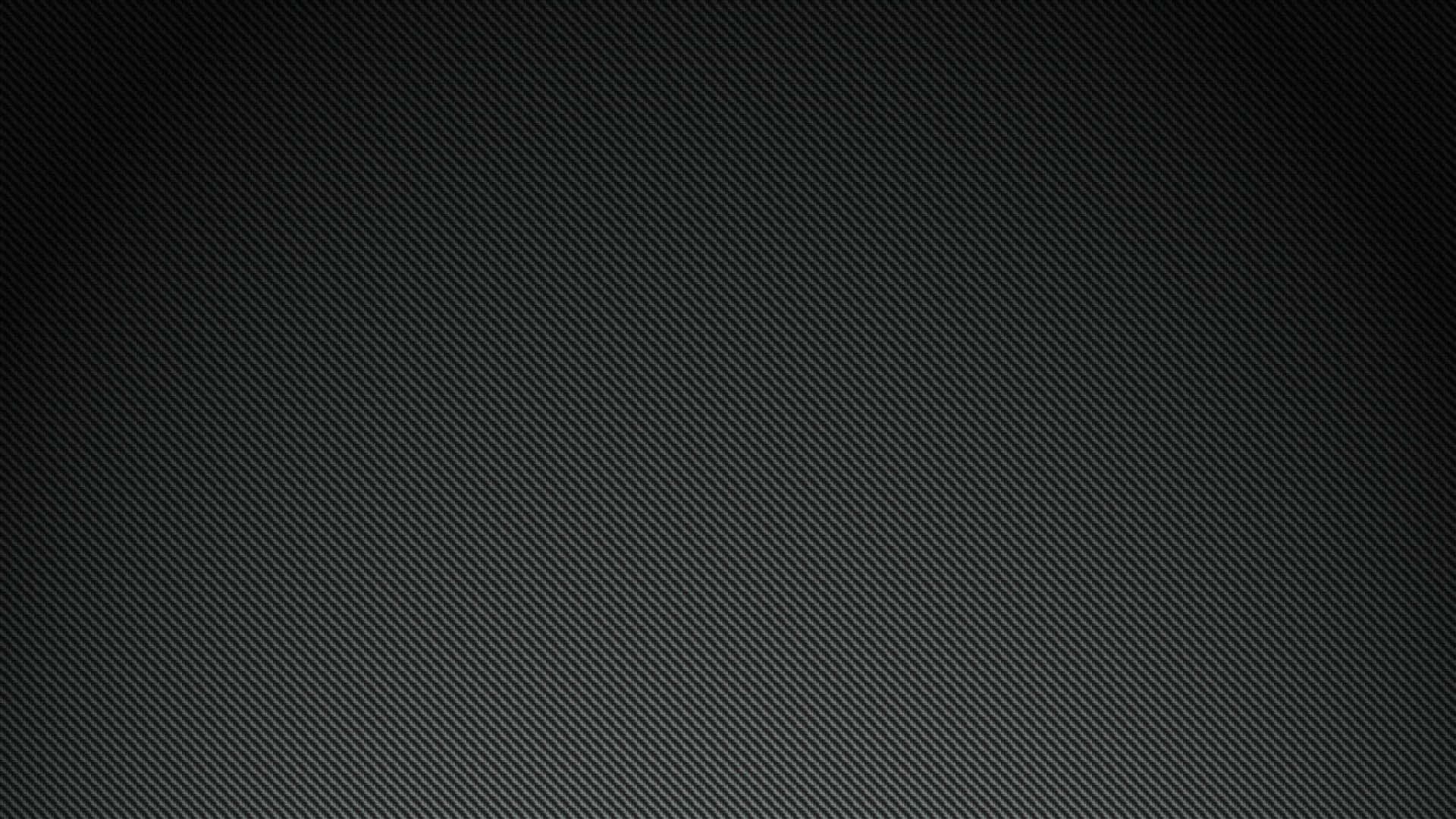A Black Background With A Light Texture Wallpaper