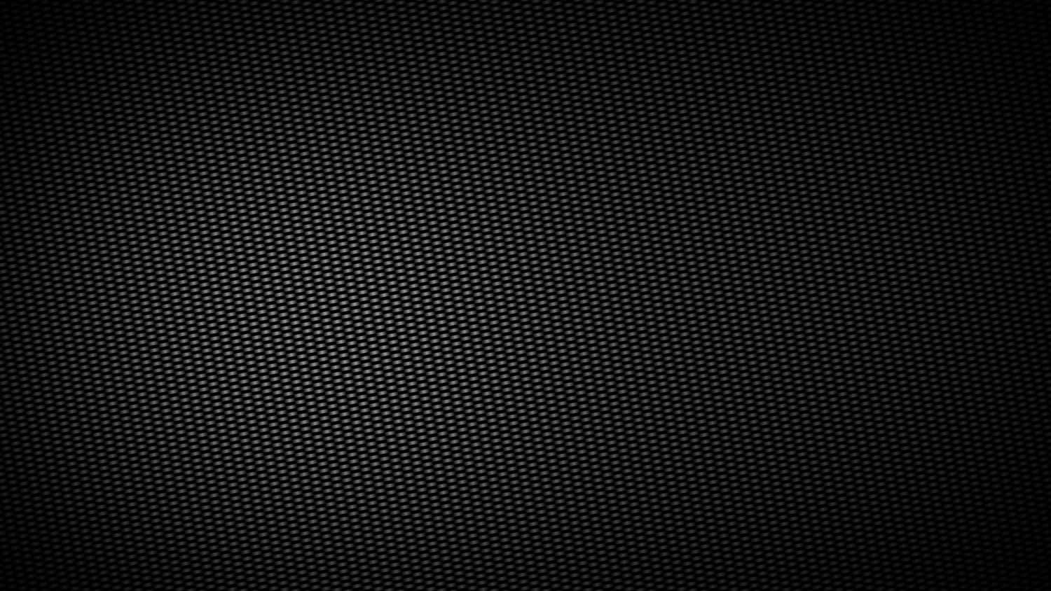 En sort baggrund med et mønster af huller. Wallpaper