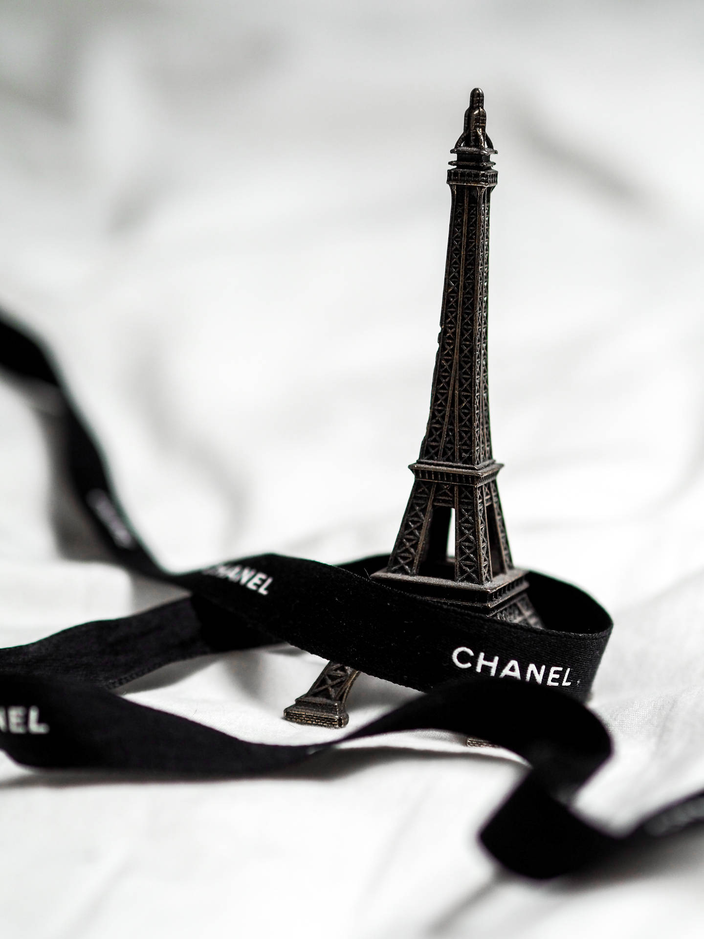 Download Black Chanel Ribbon Eiffel Tower Wallpaper