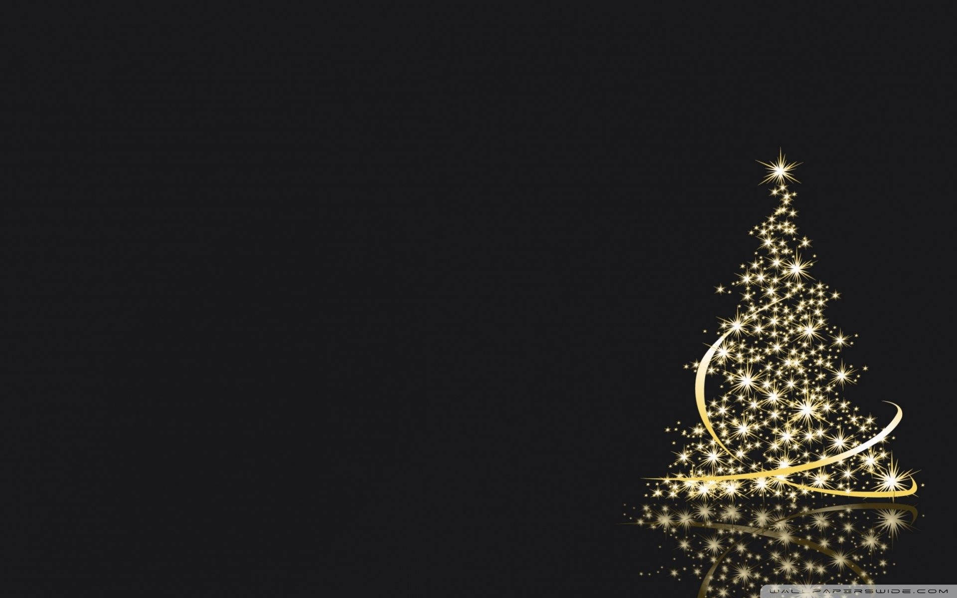 Amidst a snowy night, the Christmas tree glows a deep black. Wallpaper