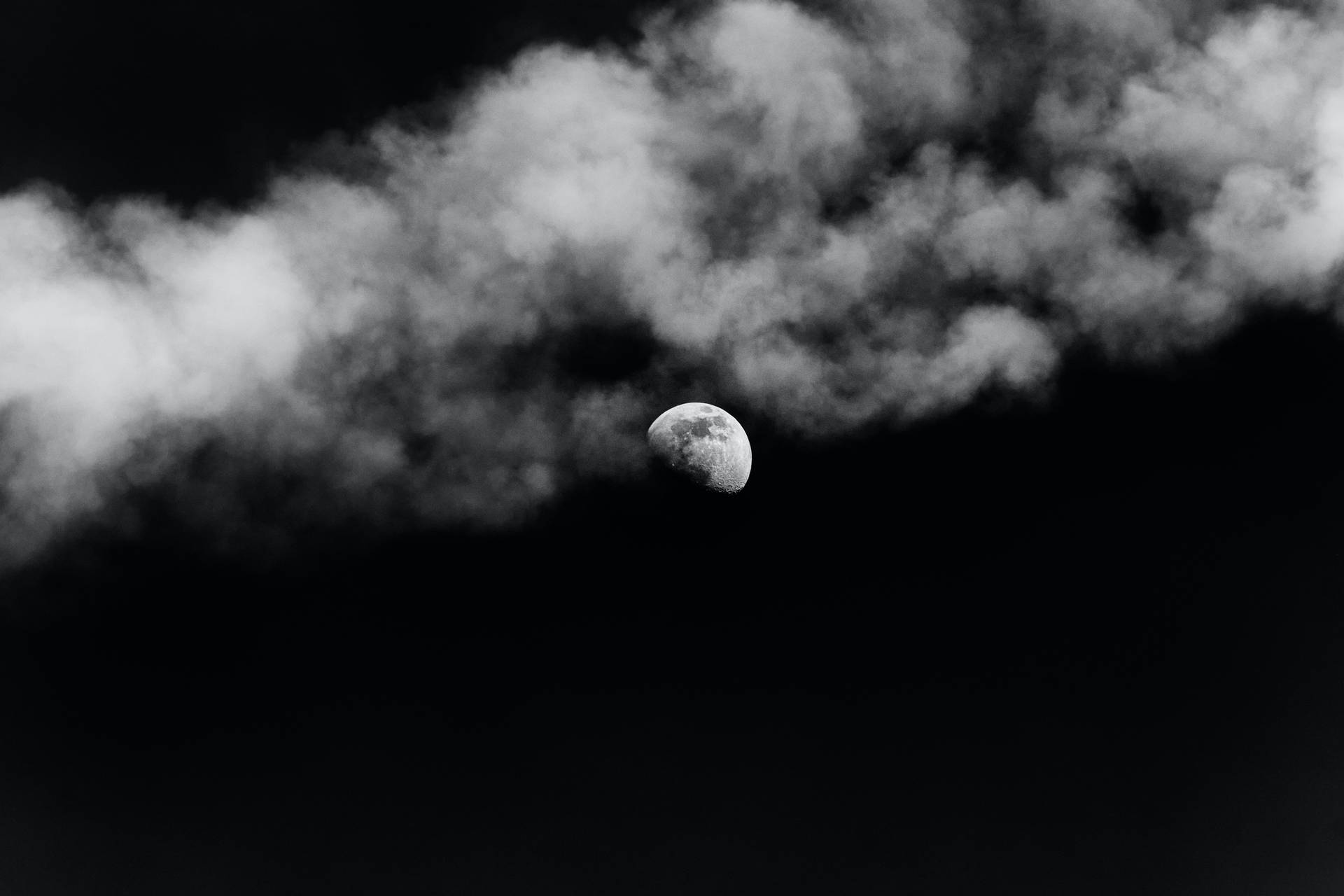 Black Clouds And A Moon Wallpaper