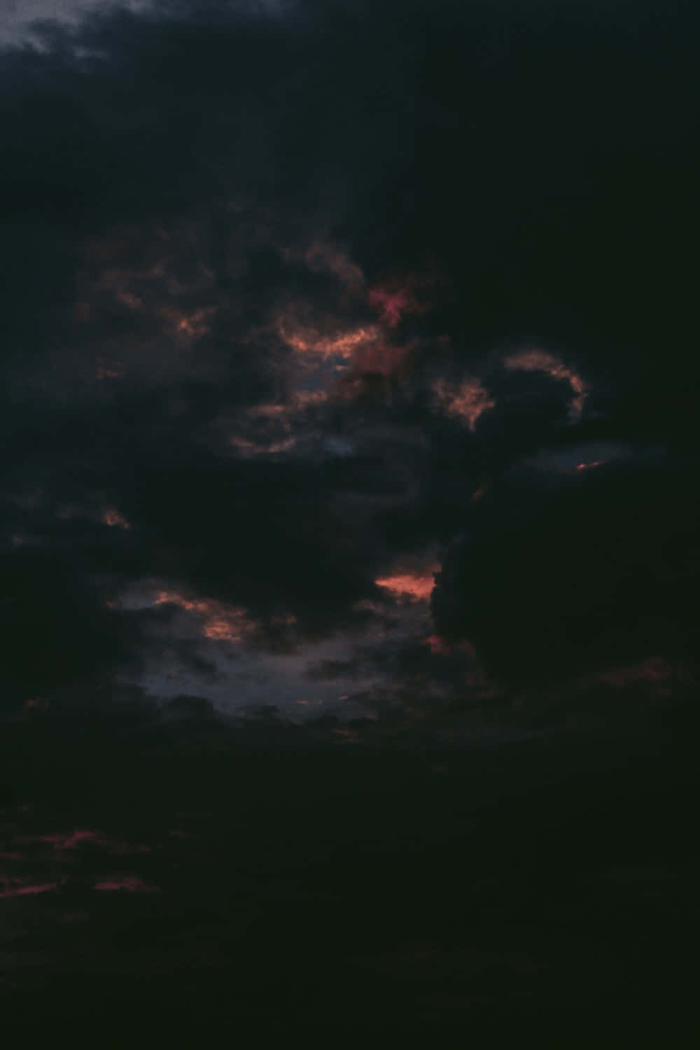 Dark, ominous clouds blocking out the sun Wallpaper