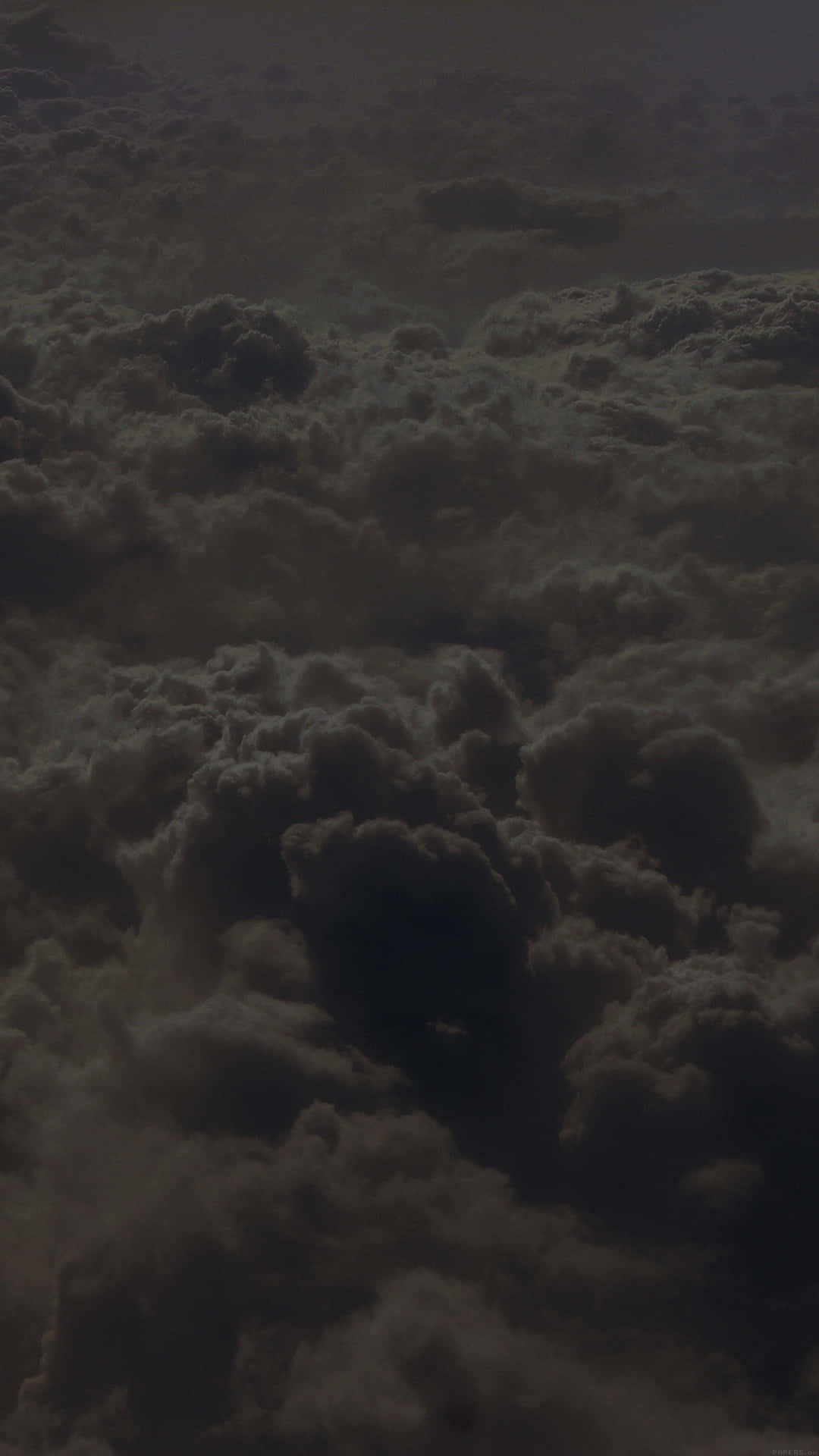 Dark and menacing black clouds above the horizon. Wallpaper