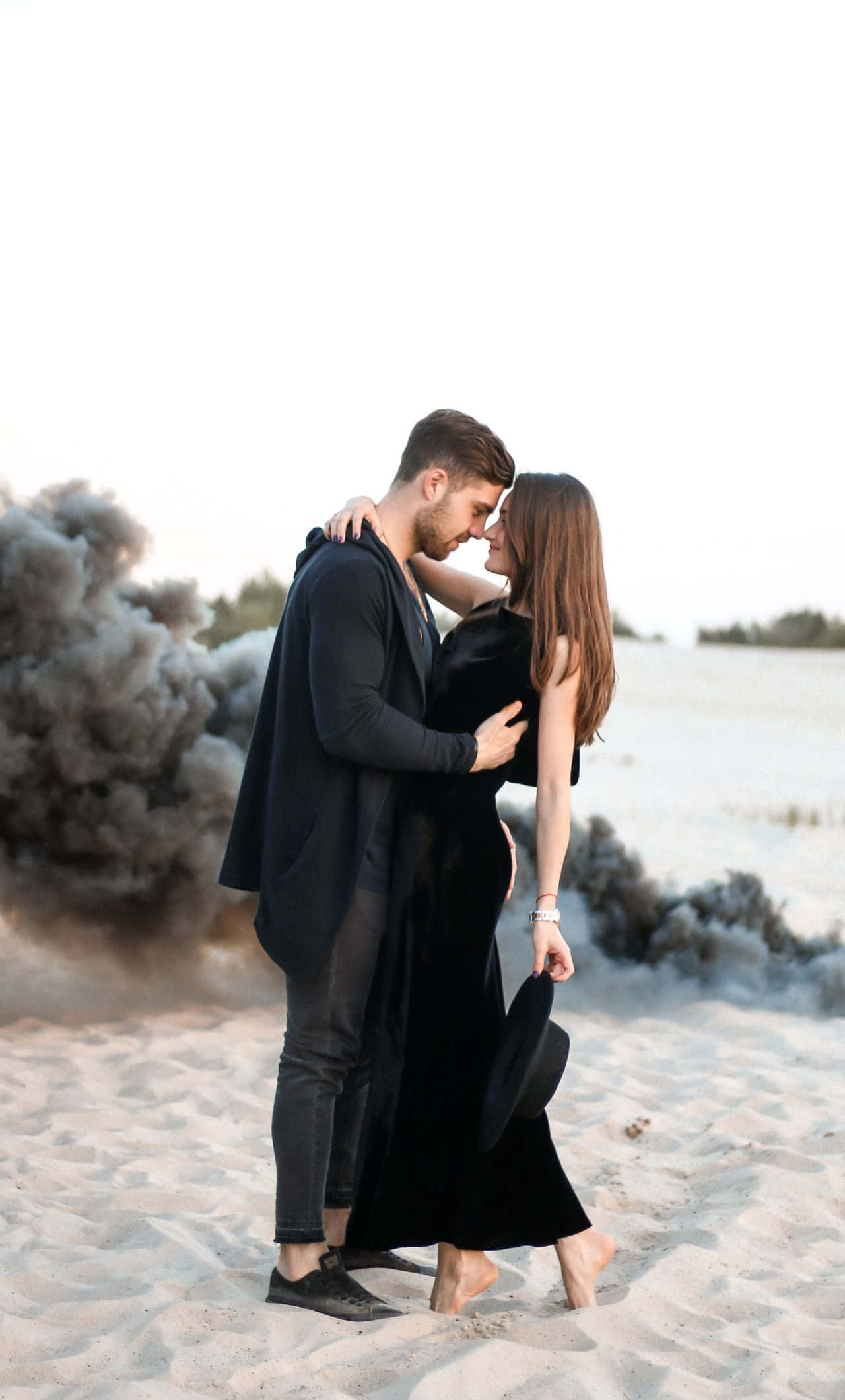 A loving black couple embracing nature Wallpaper