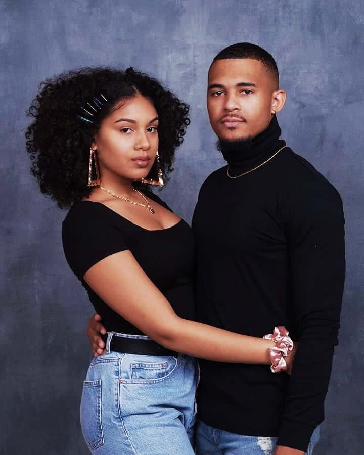 Portrait of young attractive couple posing studio dressed in black  fashionable clothes. Black-white photo. Stock Photo | Adobe Stock