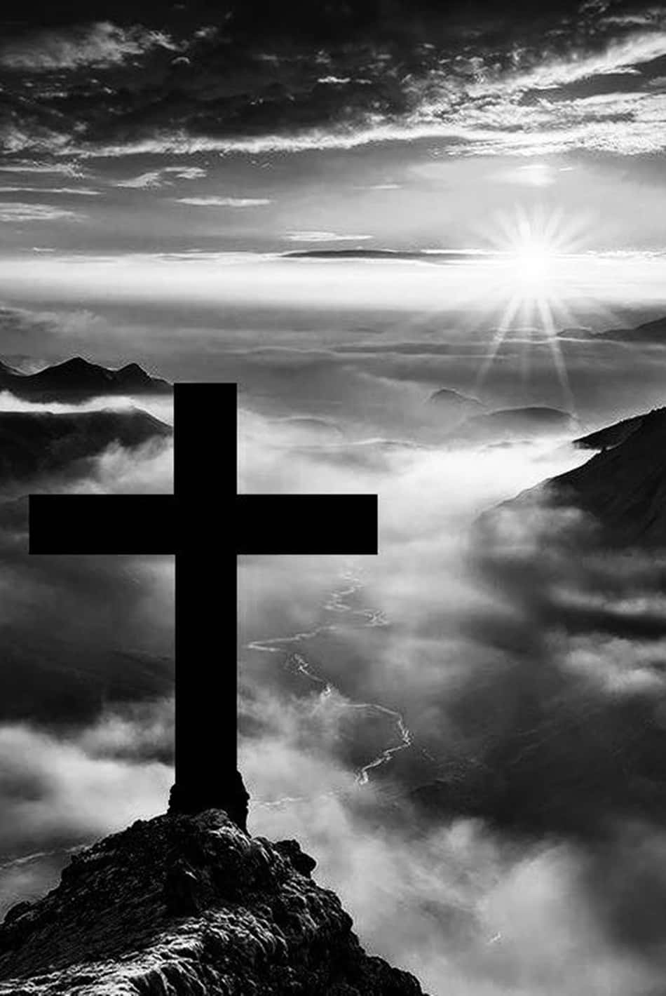 A stark and emotive Black Cross set against a white background Wallpaper