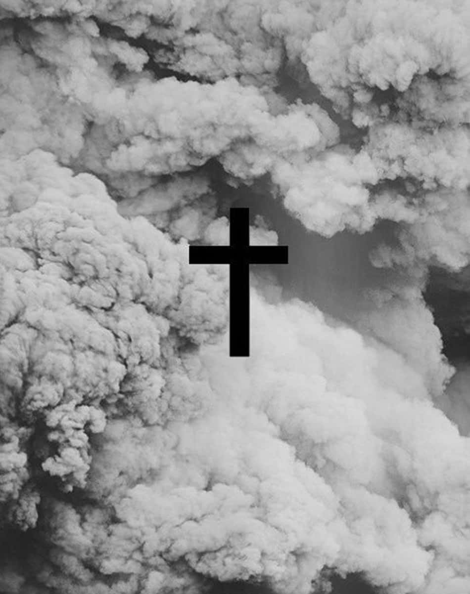 Download A black cross lone against a white sky Wallpaper 