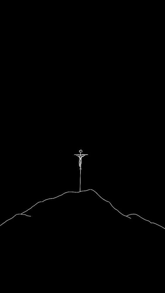 A black cross stands tall against the backdrop of a clear night sky. Wallpaper