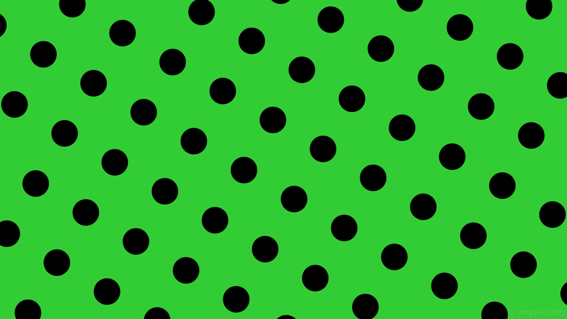 A Green Background With Black Dots Wallpaper