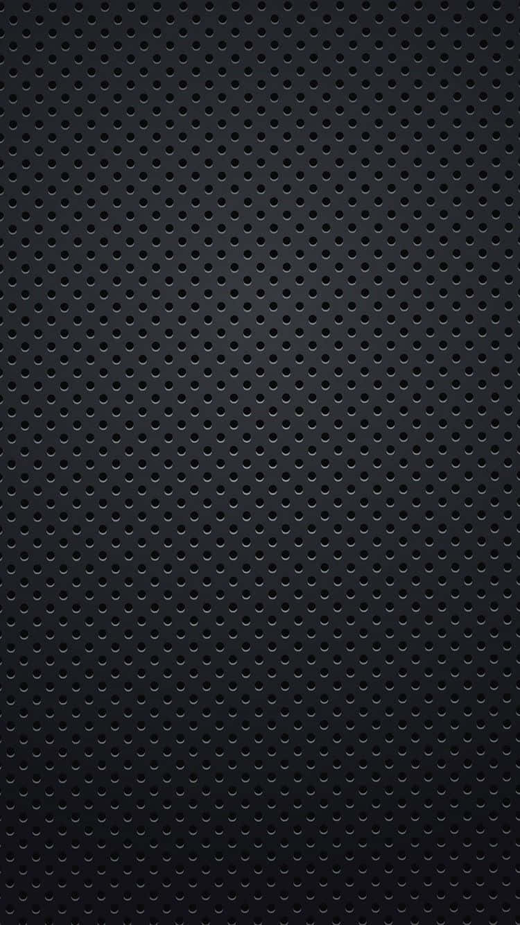 Black dots forming an intriguing pattern Wallpaper