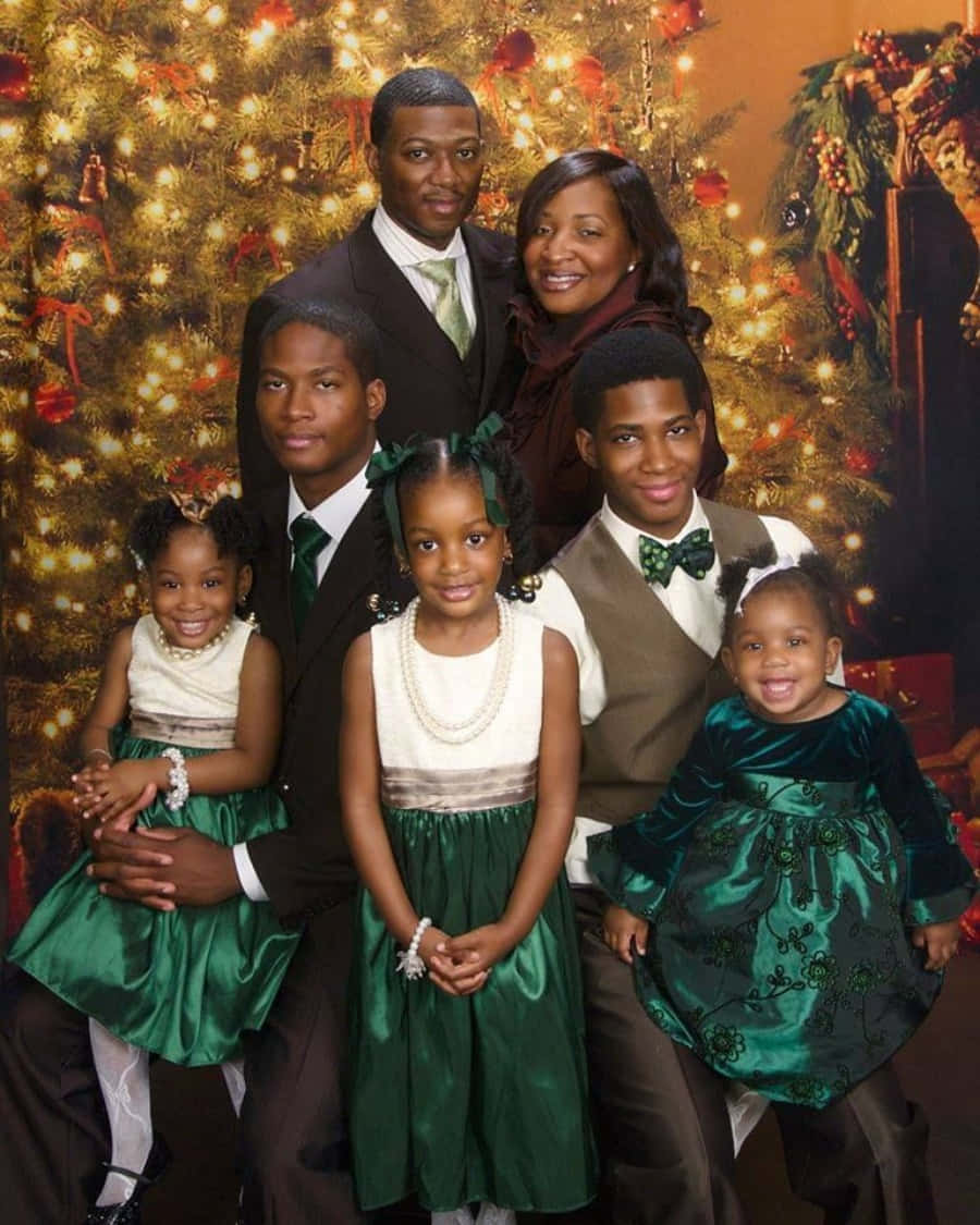 A Family Posing For A Christmas Photo