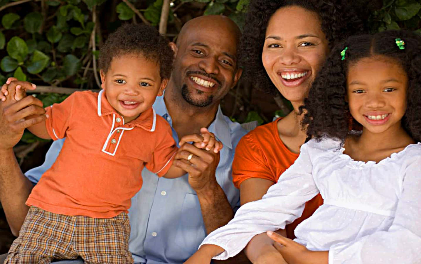 A loving black family celebrating together.