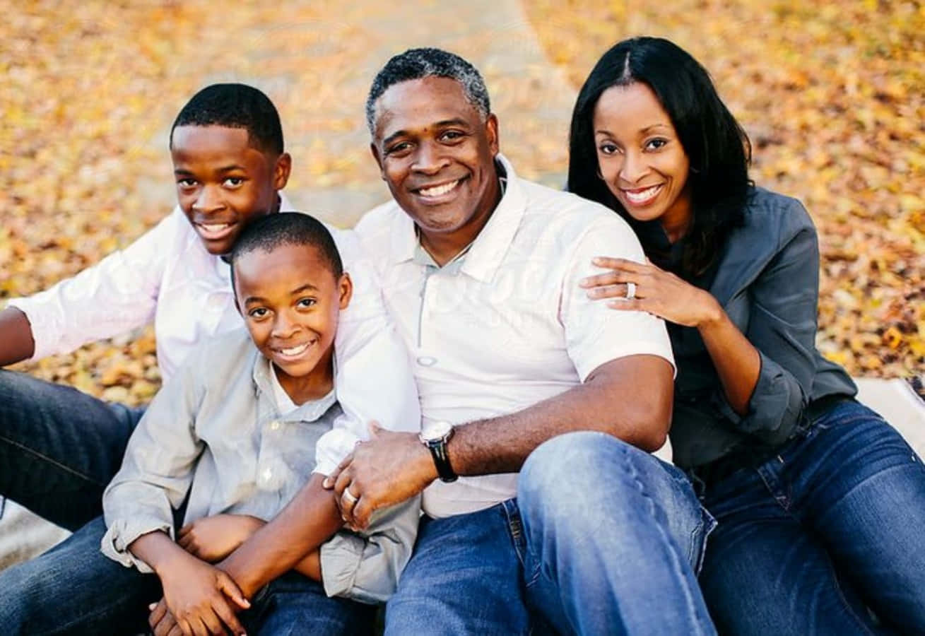 A happy Black family of five enjoying time together.