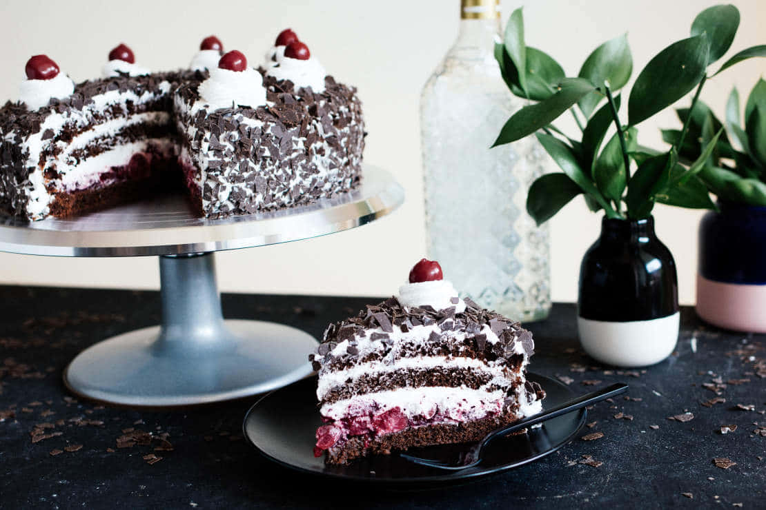 Indulge in the rich and creamy flavors of the classic Black Forest Cake Wallpaper