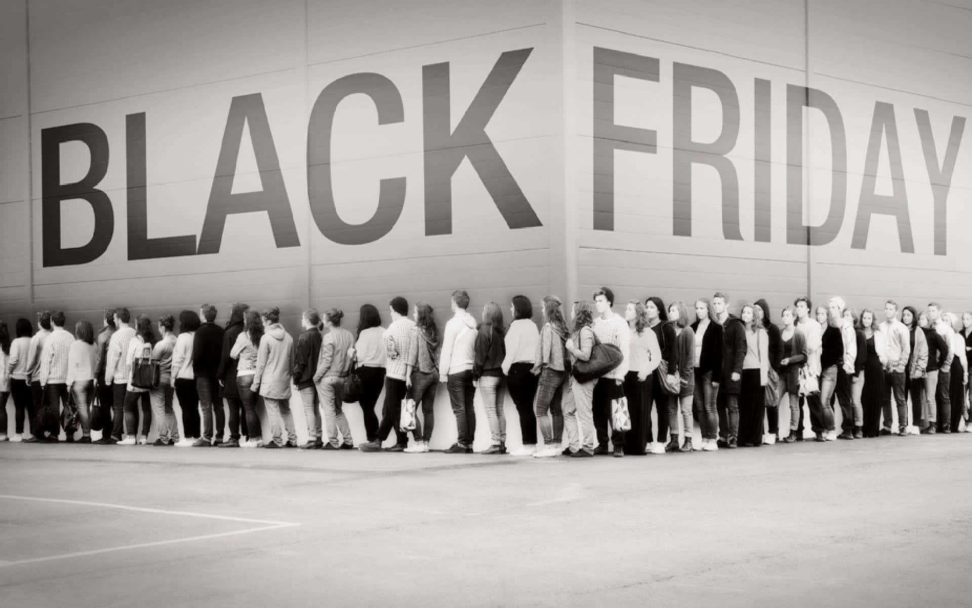 Black Friday - A Group Of People Standing In Front Of A Sign