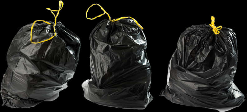 Black Garbage Bagswith Yellow Ties PNG