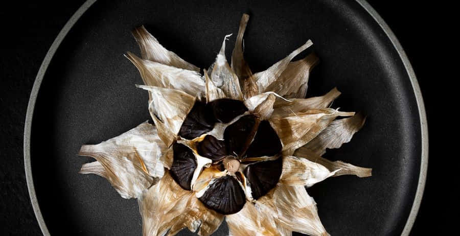 Dark and flavorful black garlic - Enjoy this savory, health-promoting ingredient Wallpaper