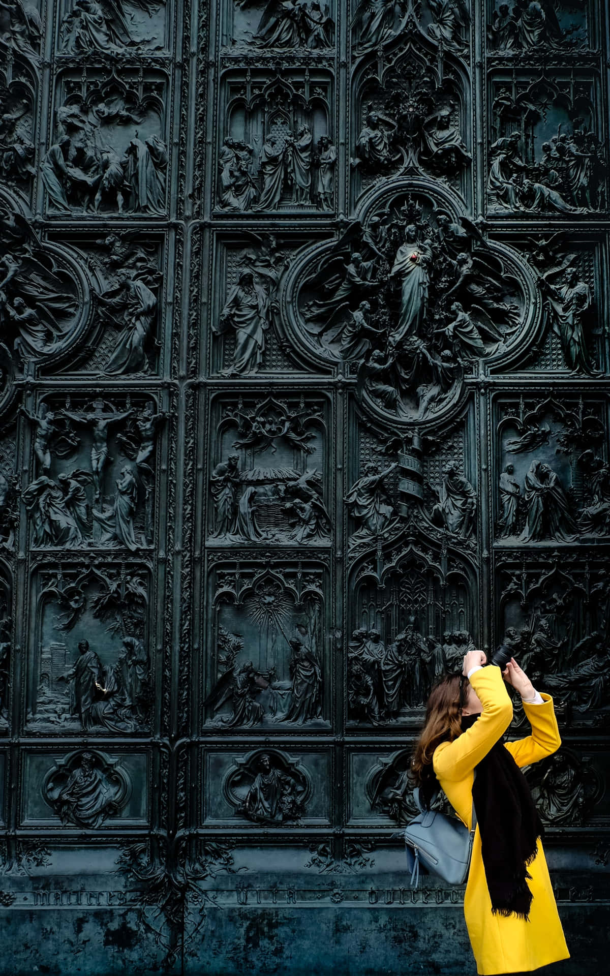 Black Gate With A Conspicuous Woman In Yellow Wallpaper