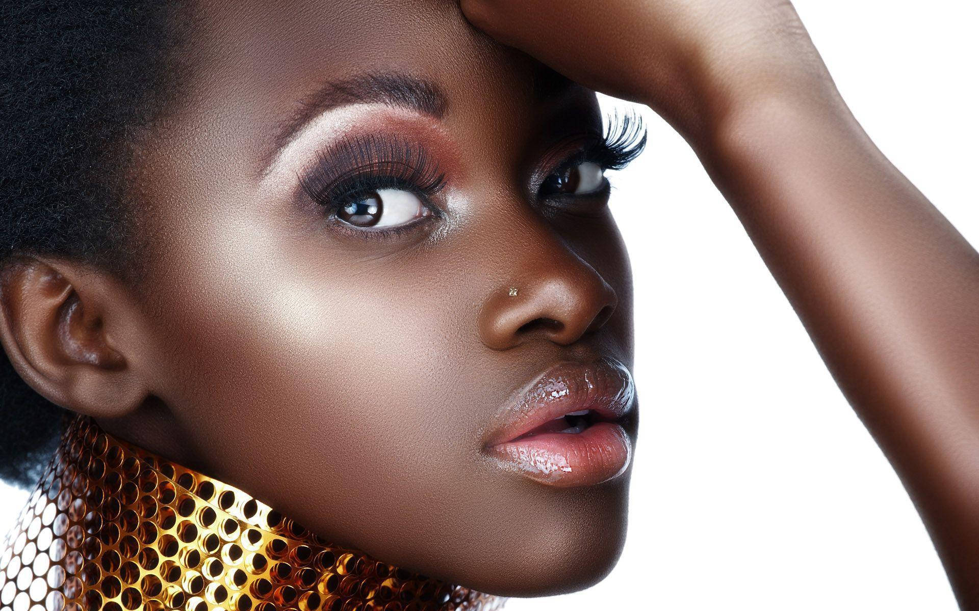 Unleashing Her Boldness: Stunning Black Girl Baddie With Glossy Makeup Wallpaper