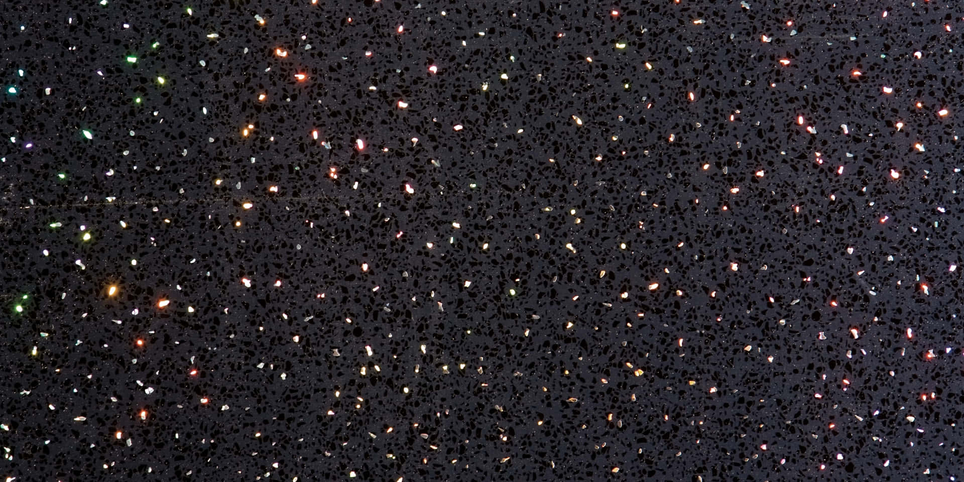 A Black Background With Colorful Stars On It