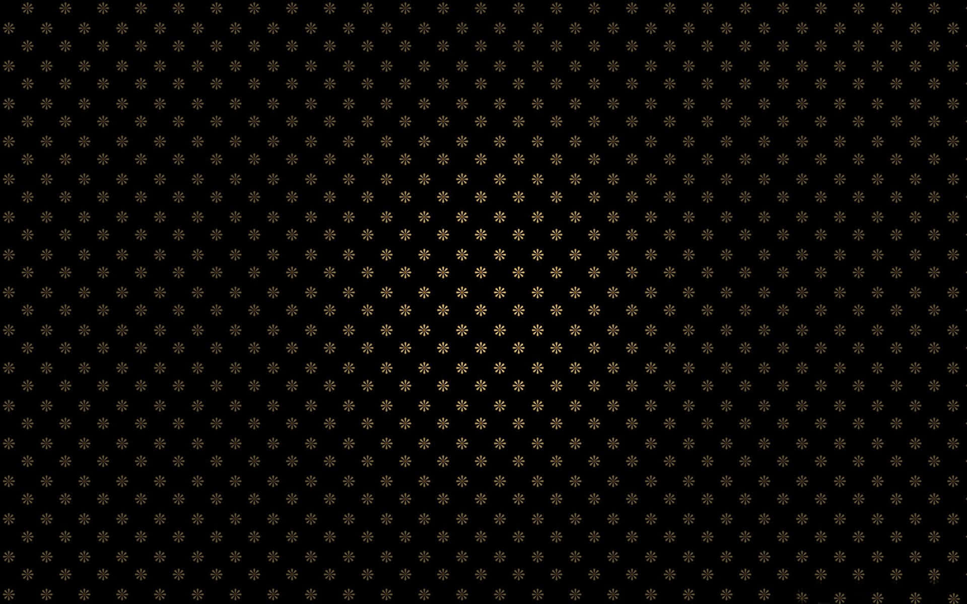 A Black Background With Gold Dots
