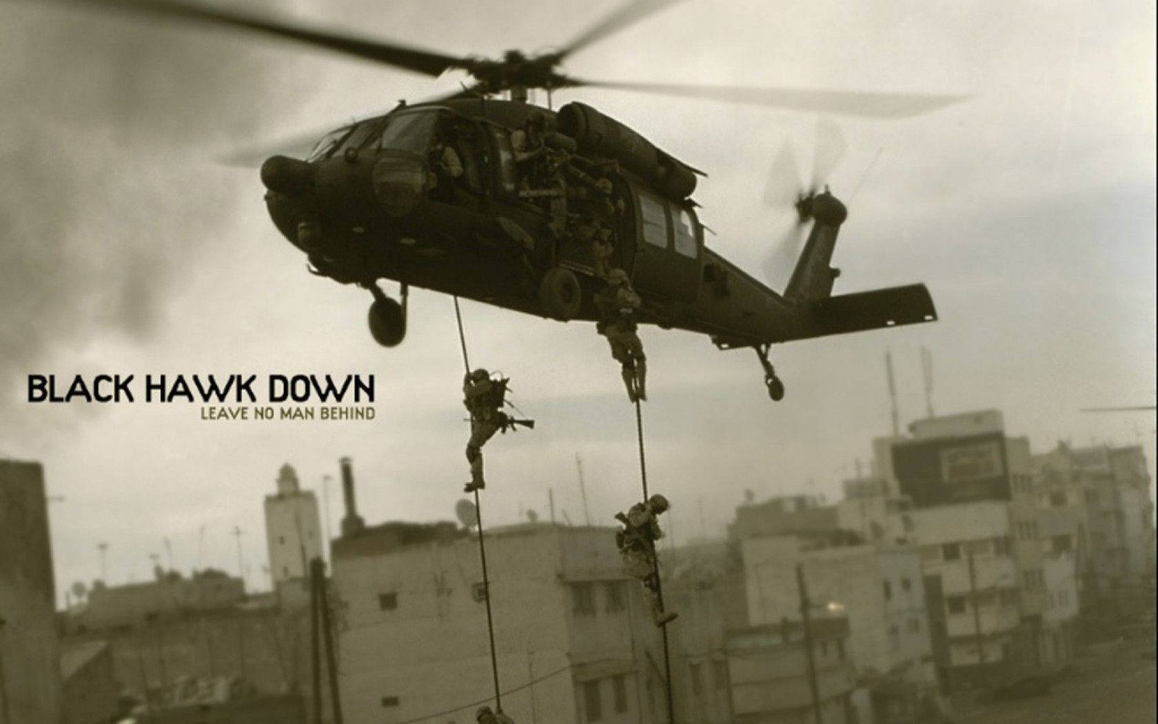 A Black Hawk Helicopter hovering over the skyline Wallpaper