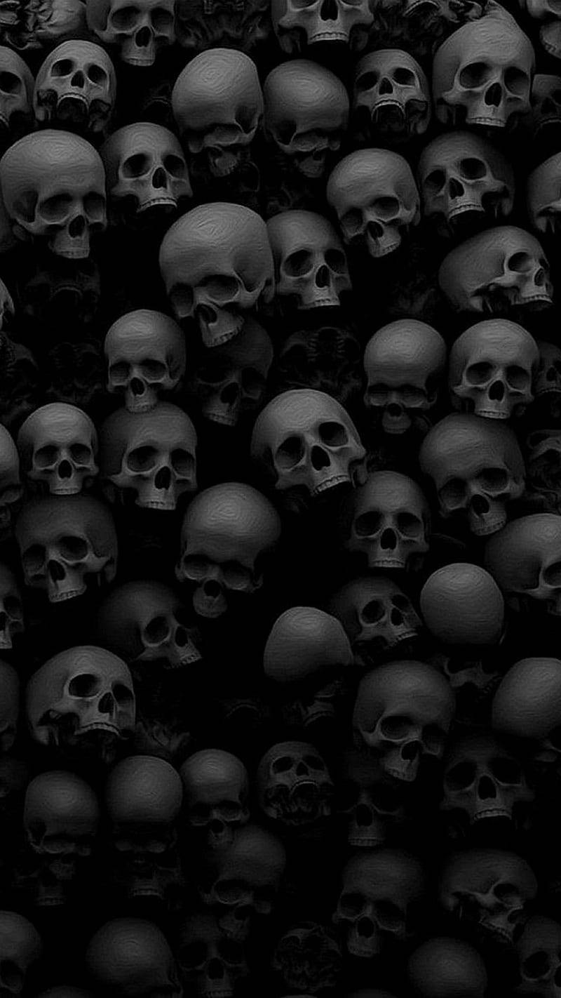 Black Horror Pile Of Skulls Wallpaper