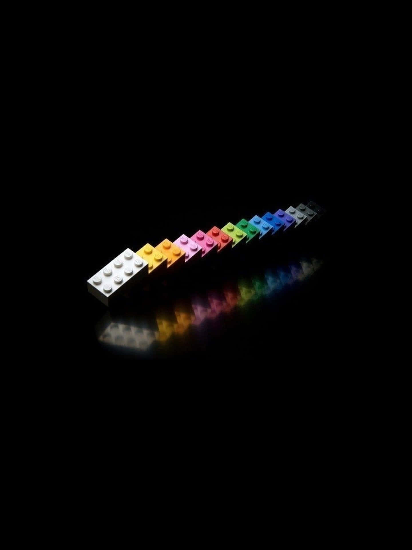 Black Ipad With Colorful Legos With Reflection Wallpaper