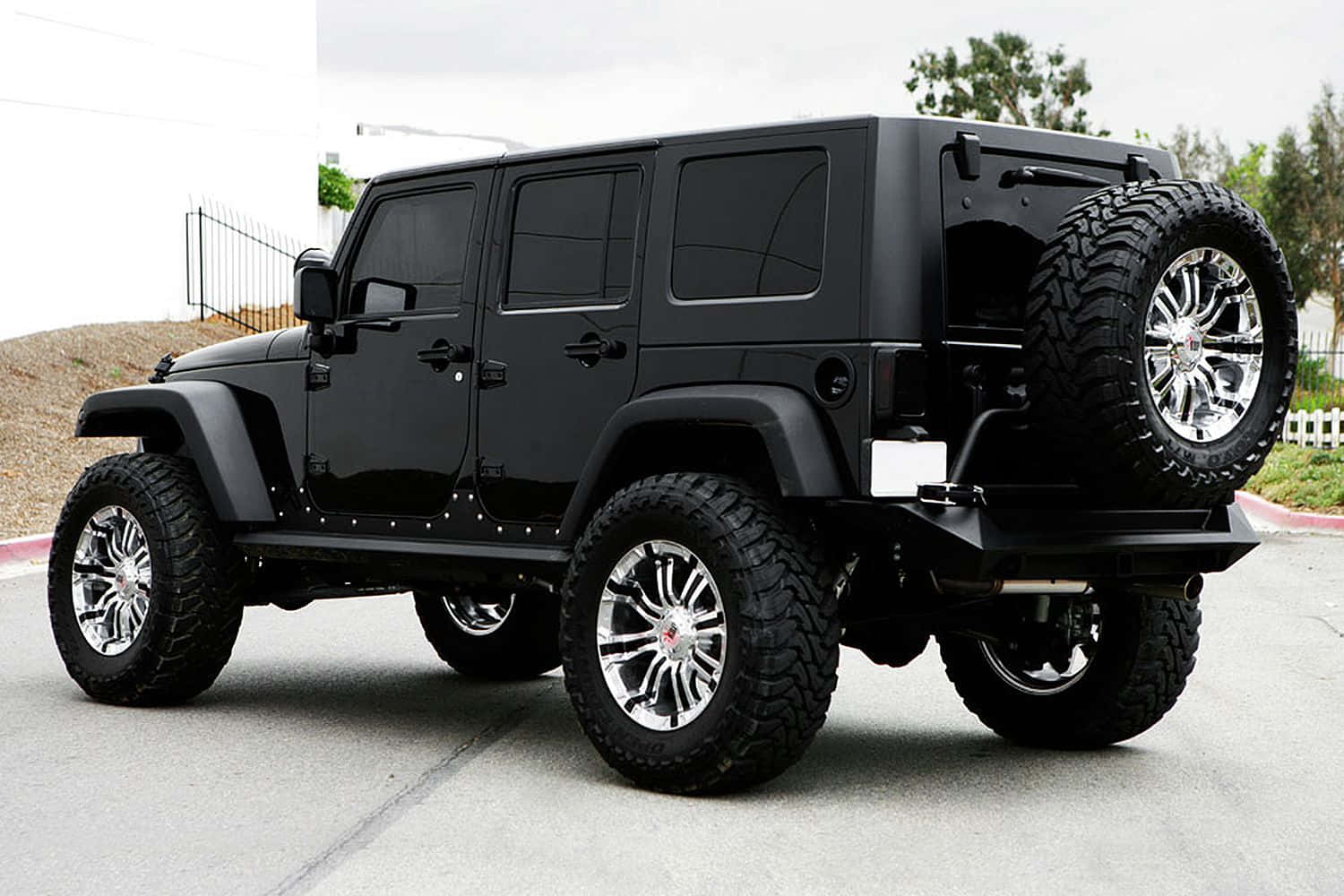 Explore the open roads with a sleek black Jeep.