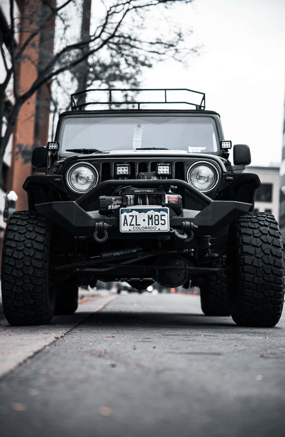 A Black Jeep Parked On A Street