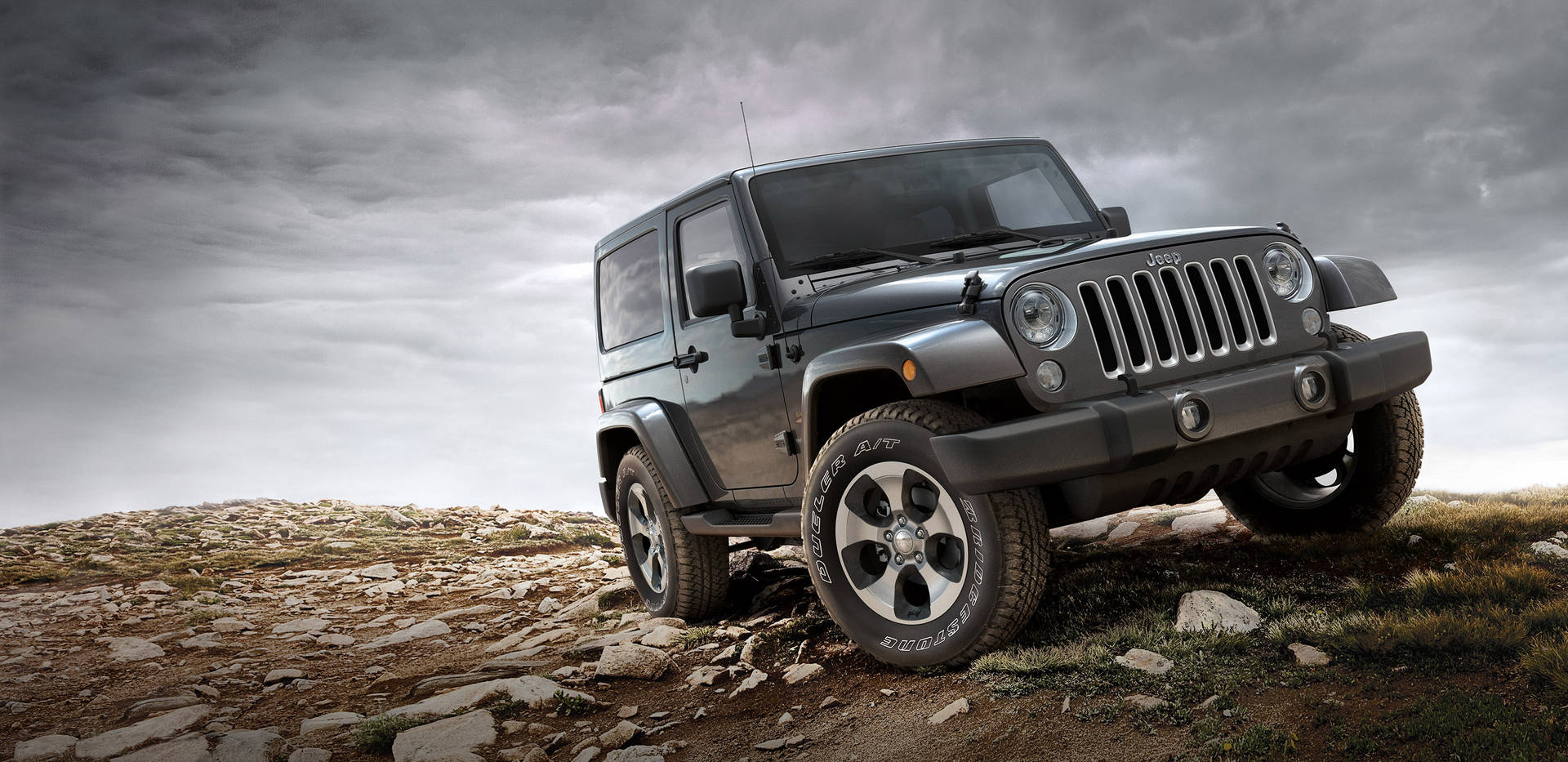 Majestic Black Jeep Wrangler highlighted by a striking silver logo Wallpaper