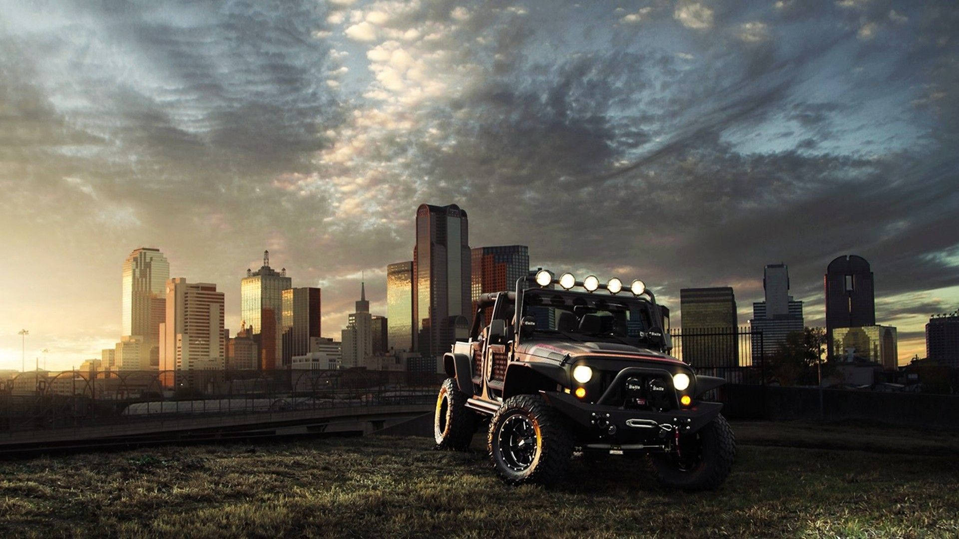 Sort Jeep Wrangler Med Skyskrabere i Baggrunden Wallpaper