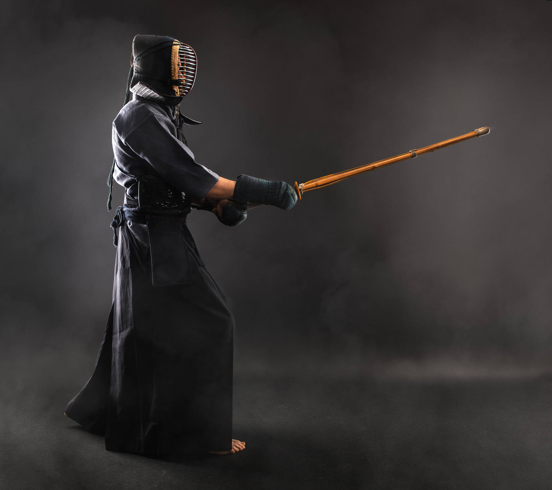 Duel of Determination - A Kendo Fighter in Action Wallpaper