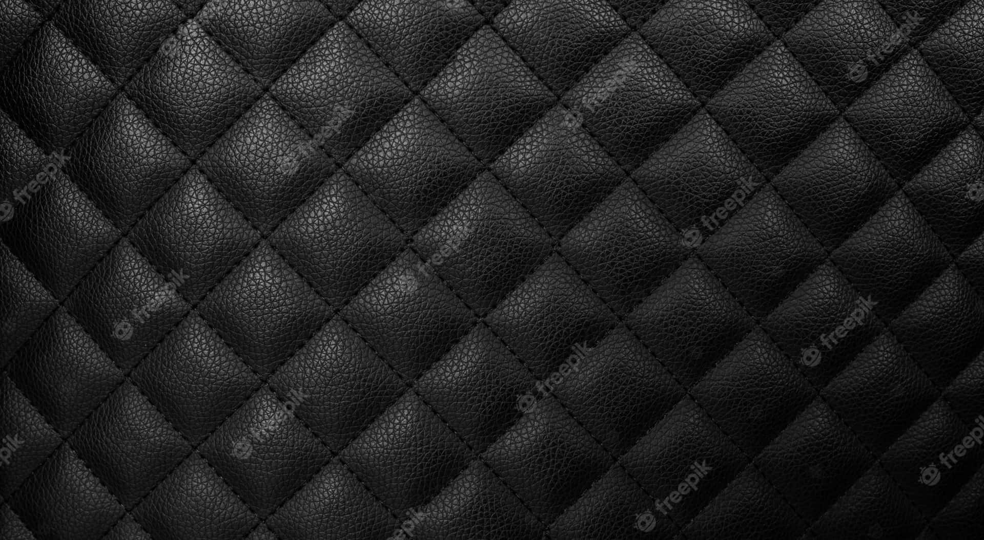 Stylisk sort læder - det perfekte tilbehør til enhver stil Wallpaper