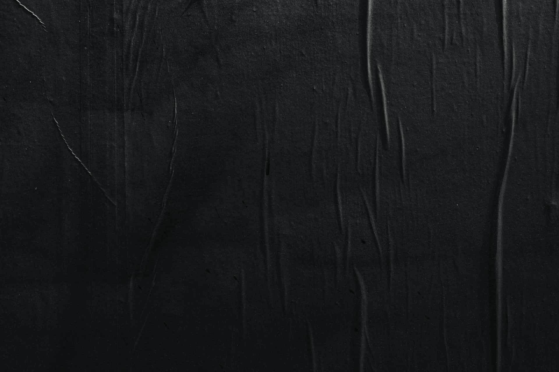 Eineschwarze Wand Mit Schwarzer Farbe Wallpaper