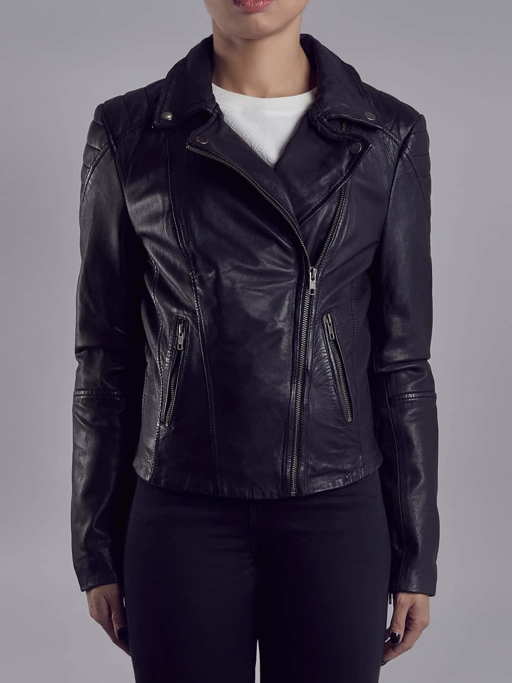 Download A Woman Wearing A Black Leather Jacket | Wallpapers.com