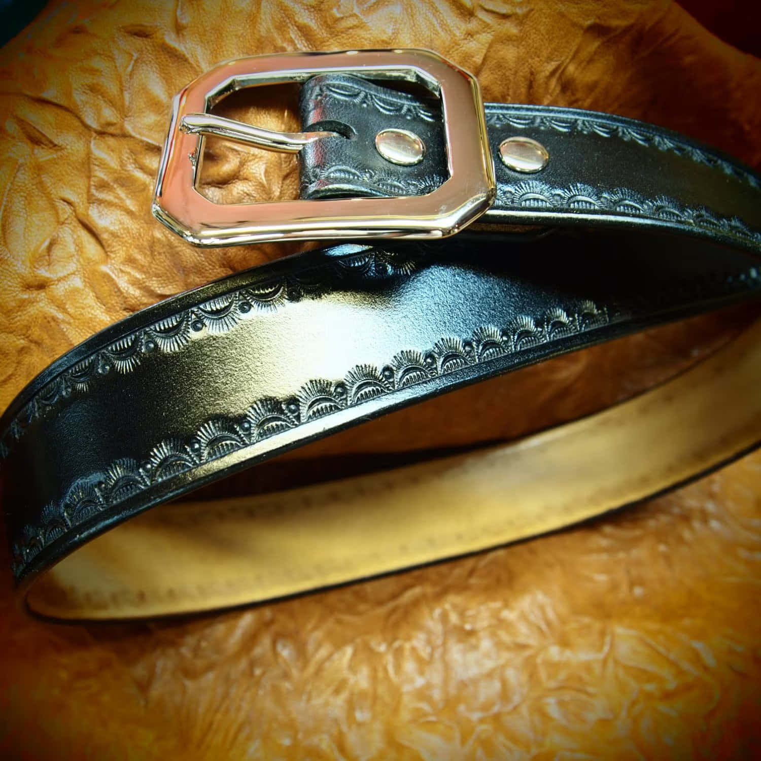 A Black Leather Belt With A Silver Buckle