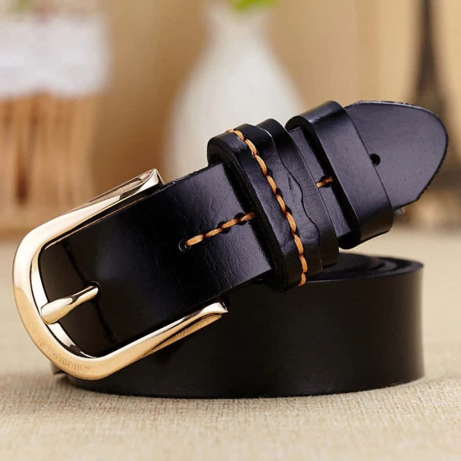 A Black Leather Belt With Gold Buckle