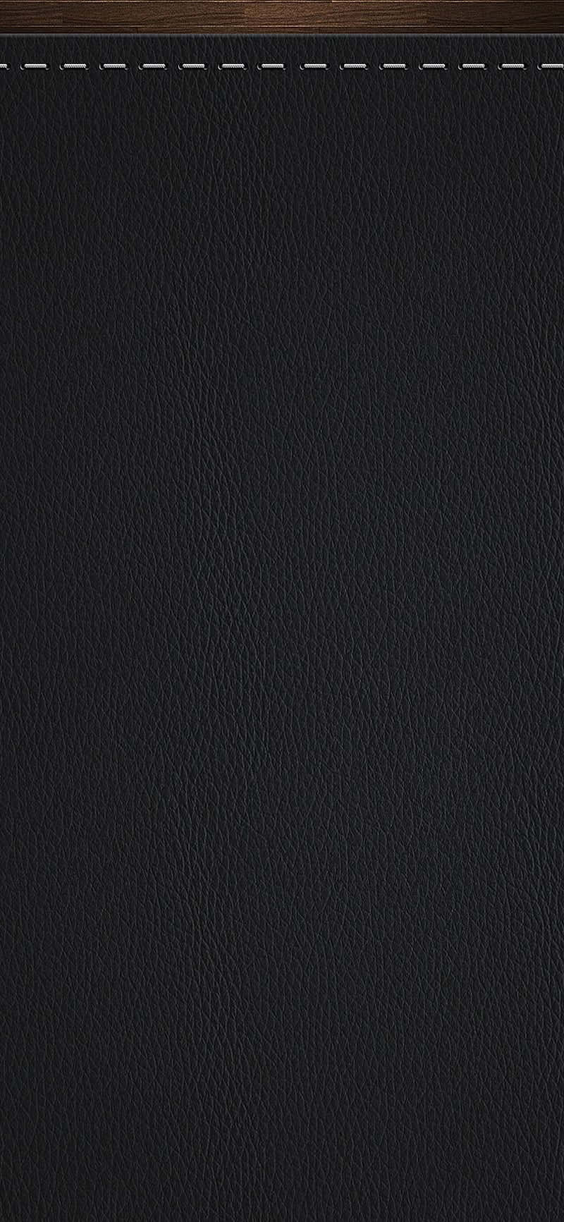 Glanset sort læderstof, der skinner, når det fanger lyset. Wallpaper