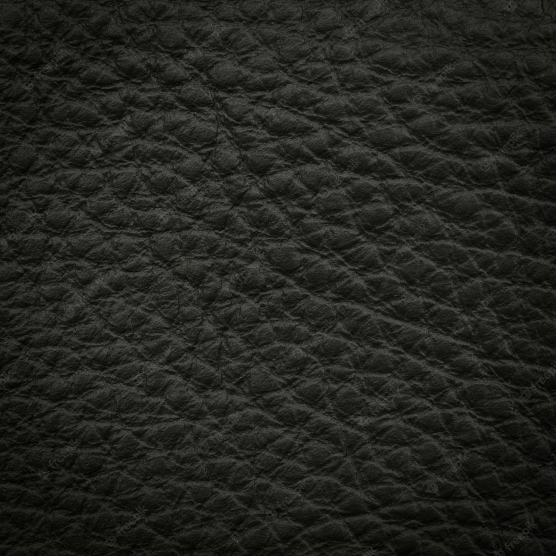 Polsk sort læder afspejler luksus og elegance. Wallpaper